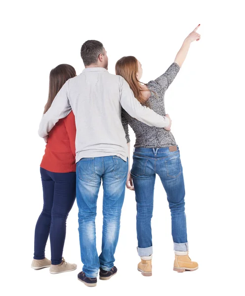 Achteraanzicht van drie vrienden die omhoog wijst — Stockfoto