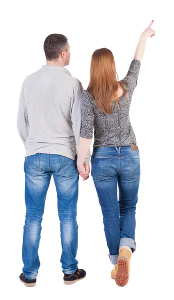 Casal segurando as mãos apontando para fora — Fotografia de Stock