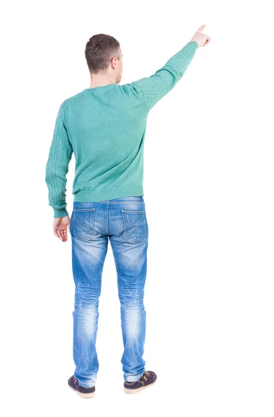 Homem de camisola verde apontando para cima — Fotografia de Stock