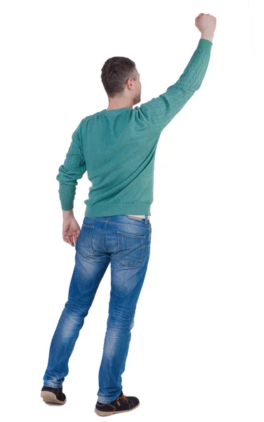 Man in green pullover holding fist up — Stock Photo, Image