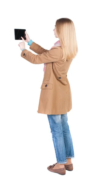 Woman in coat using tablet computer — Stock Photo, Image