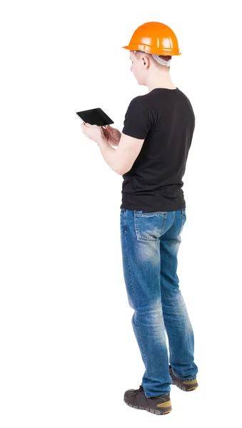 Engineer in helmet using tablet computer — Stock Photo, Image