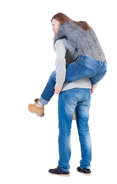 Vista posterior de la joven pareja abrazando —  Fotos de Stock