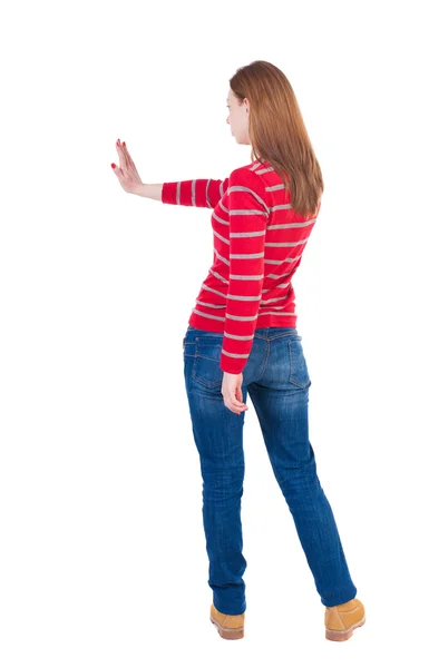 Young woman presses down on something. — Stock Photo, Image