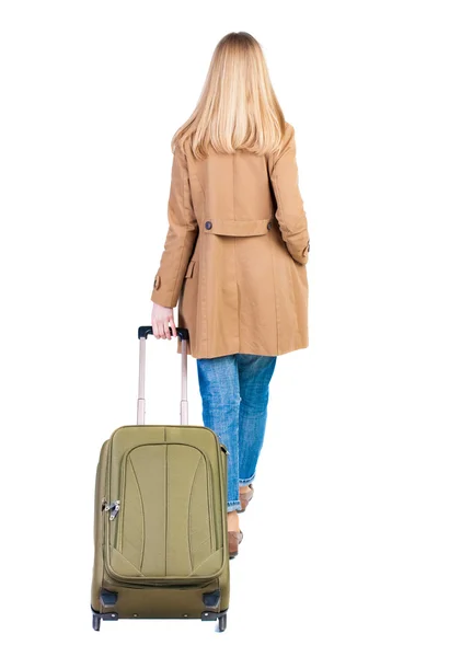 Back view of walking  woman  with suitcase — Stock Photo, Image