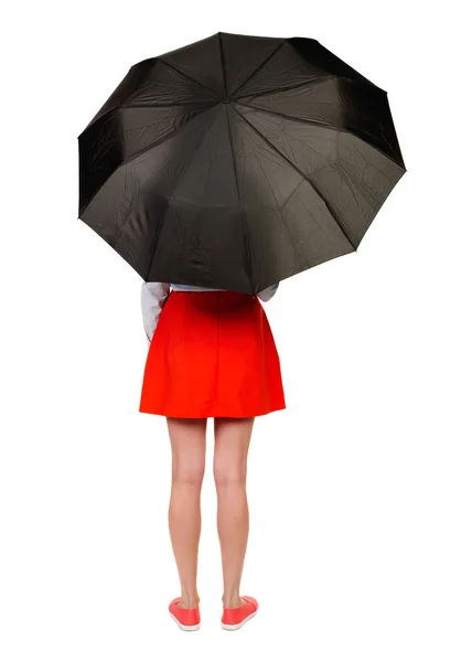 Junge Frau unter einem Regenschirm. — Stockfoto