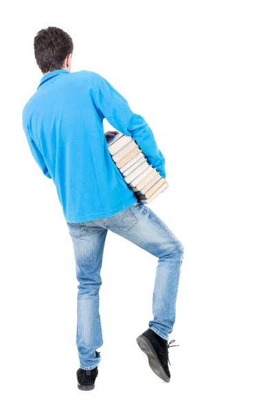 Ein Mann trägt Bücher — Stockfoto