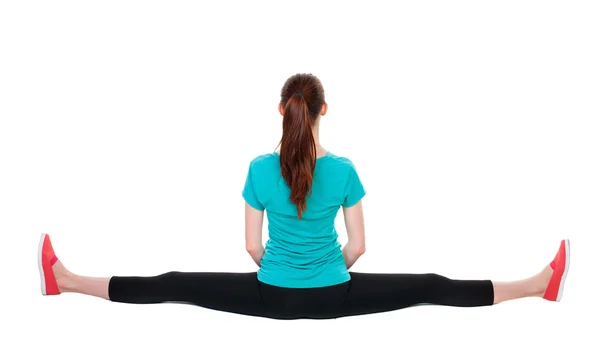 Sportswoman sitting on a longitudinal splits — Stock Photo, Image