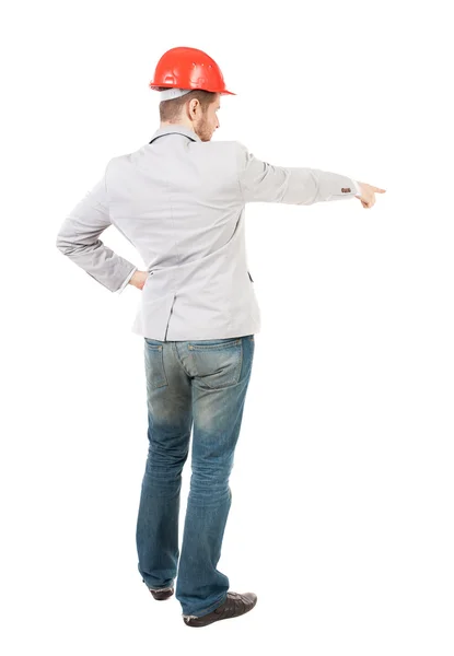 Back view of  pointing man in helmet. — Stock Photo, Image