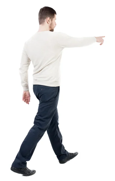 Back view of man in jeans pointing — Stock Photo, Image