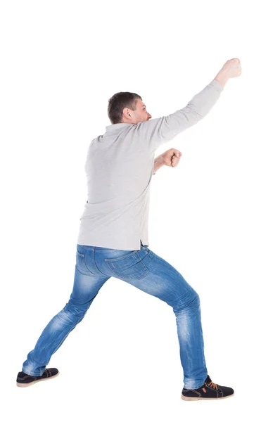 Man pulling a rope — Stock Photo, Image