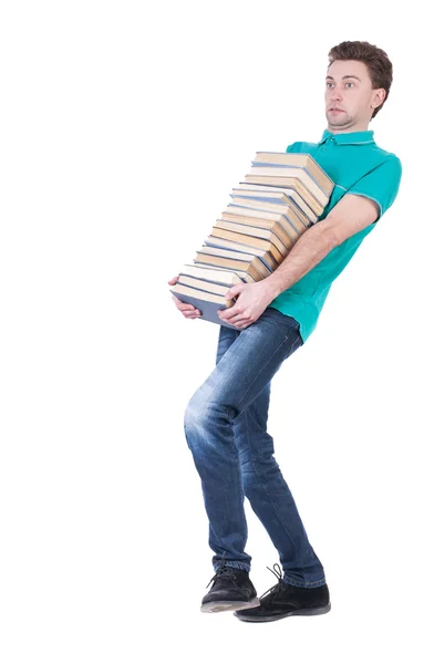 Achteraanzicht van de mens draagt boeken. — Stockfoto