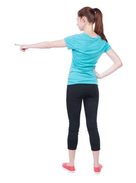 Pointing woman in sportswear. — Foto Stock