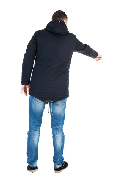 Pointing man in winter jacket — Stock Photo, Image