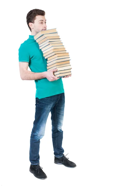 Homem carrega a pilha de livros. — Fotografia de Stock