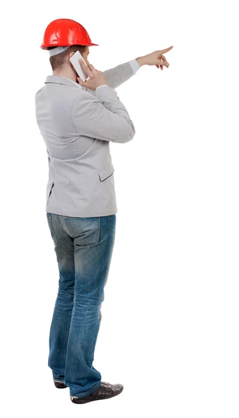 Businessman in  helmet using tablet — Stock Photo, Image