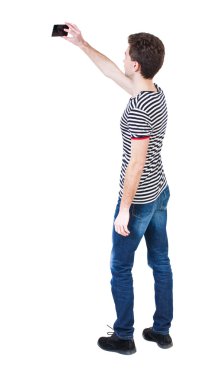 Back view of man with mobile phone
