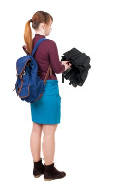 young woman with backpack and umbrella