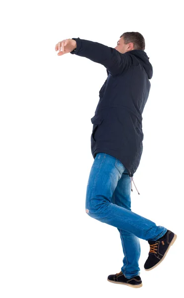 Balancing young man — Stock Photo, Image