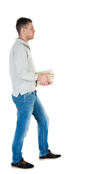 Man carries stack of books. — Stock Photo, Image