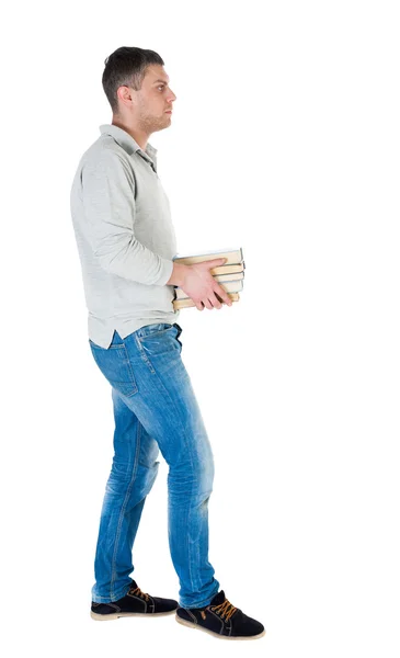 Man carries stack of books. — Stock Photo, Image