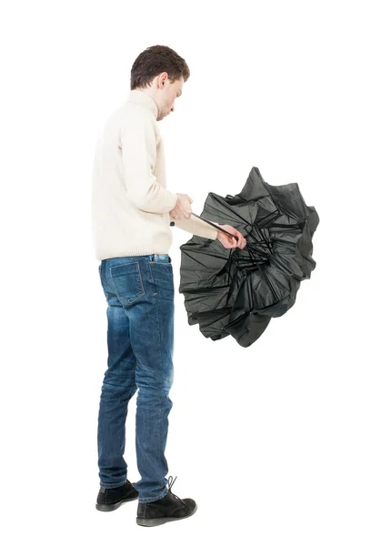 Man in jeans with umbrella. — Stock Photo, Image