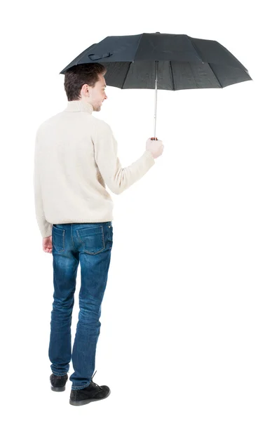 Вид ззаду чоловіка під парасолькою — стокове фото