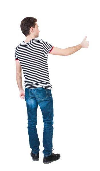 Человек в рубашке показывает большие пальцы руки вверх. — стоковое фото