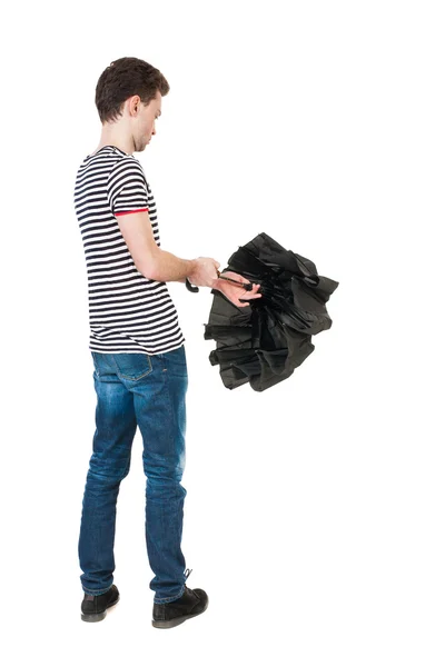 Man in jeans  with umbrella. — Stockfoto