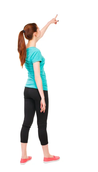 Vista posteriore di puntamento donna in abiti sportivi. — Foto Stock