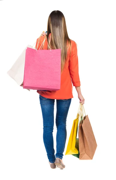 Mujer en jeans con bolsas de compras — Foto de Stock