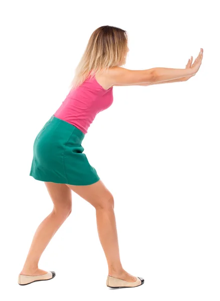 Woman pushes wall. — Stock Photo, Image