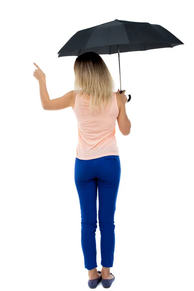 Вказуюча жінка під парасолькою — стокове фото