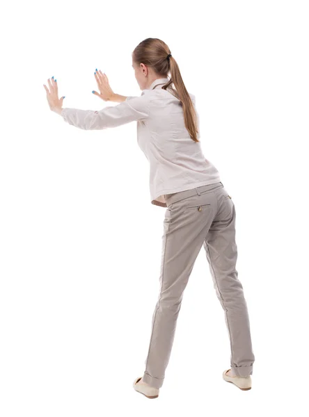 Woman pushes wall. — Stock Photo, Image