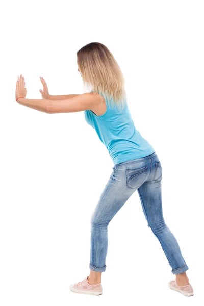 Woman pushes wall. — Stock Photo, Image