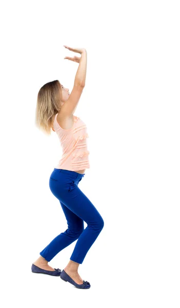 Woman  holding something heavy — Stock Photo, Image