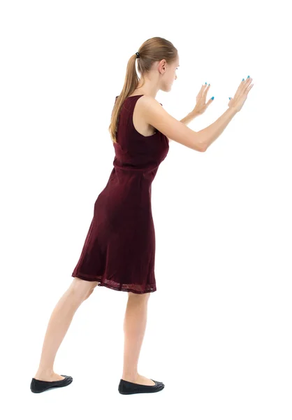 Woman pushes wall. — Stock Photo, Image