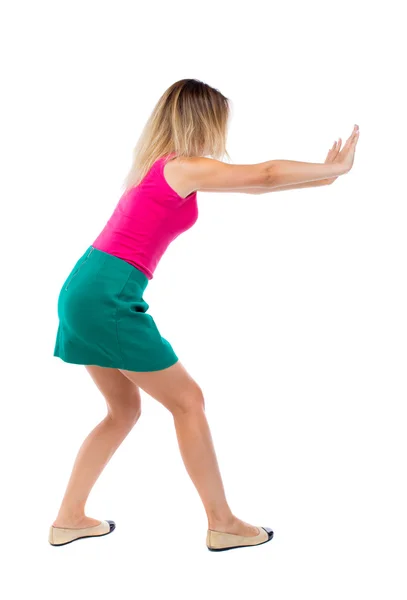 Woman pushes wall. — Stock Photo, Image