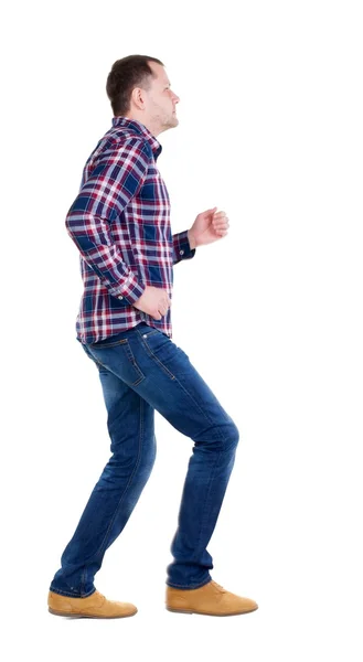 Running man in checkered shirt. — Stock Photo, Image