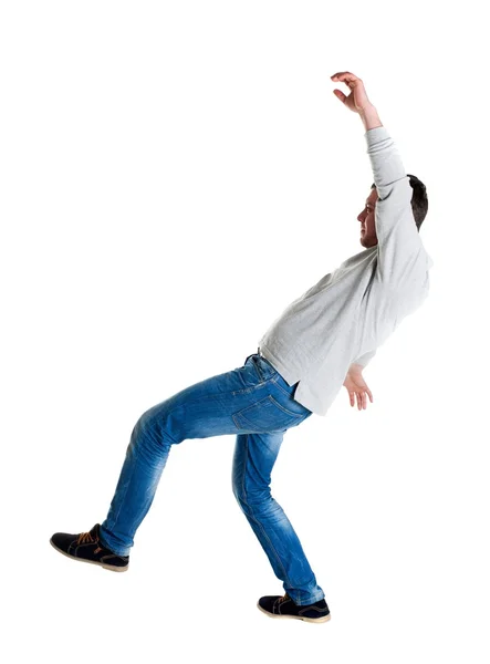 Balancing young man — Stock Photo, Image