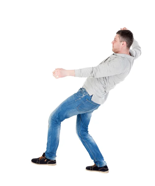 Balancing young man — Stock Photo, Image