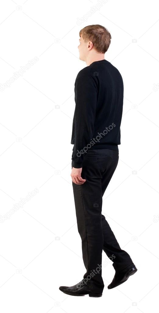 side view of walking  business man