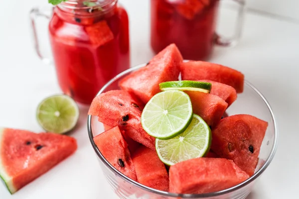 Watermelon slices with lime and smoothie — Stock Photo, Image