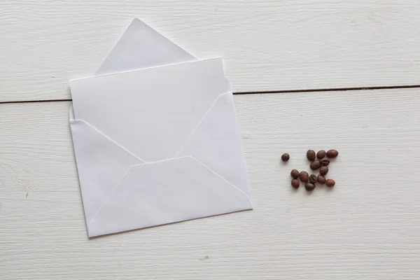 Envelope mock-up on the wooden table