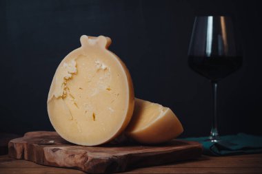 Delicious Caciocavallo, a traditional tasty cheese from Puglia region clipart