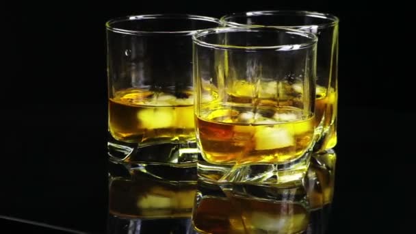 Whiskey revolves around (front) — Stock Footage Whiskey revolves around (front) Royalty Free Stock Video