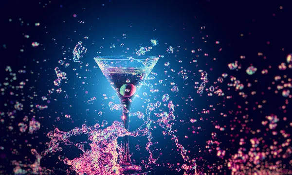 Colourful cocktail in glass with splash — Stock Photo, Image