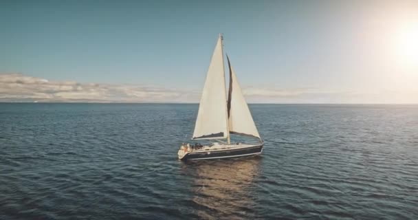Sailing yacht race at sun light aerial. Yachting on serene seascape at open sea. Boat big white sail — Stock Video
