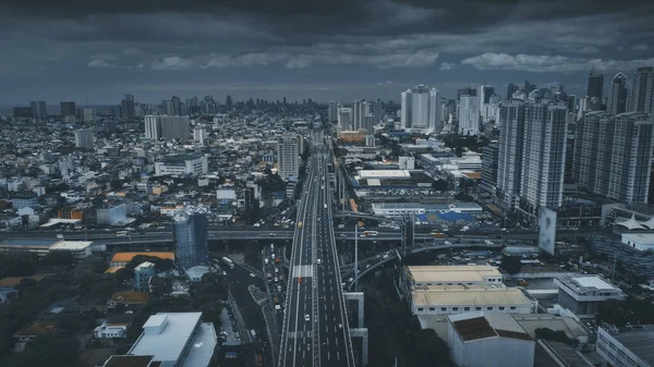 Traffic road with cars and trucks at urban street aerial. High skyscrapers, buildings at cityscape — Stock Photo, Image