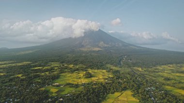 Volcano eruption at green tropical valley aerial. Mayon mount at amazing nobody nature landscape clipart